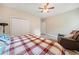 Comfortable bedroom featuring hardwood floors, ceiling fan, and a cozy recliner at 4365 Dover Crossing Dr, Marietta, GA 30066
