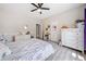 Cozy bedroom with hardwood floors, ceiling fan, and natural light at 4365 Dover Crossing Dr, Marietta, GA 30066