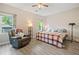 Bright bedroom with hardwood floors, ceiling fan, a window view, and comfortable seating at 4365 Dover Crossing Dr, Marietta, GA 30066
