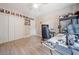 Neutral bedroom with ceiling fan, laminate floors, closet and wall decor at 4365 Dover Crossing Dr, Marietta, GA 30066