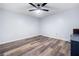 Clean and bright bedroom space with hardwood flooring and ceiling fan at 4365 Dover Crossing Dr, Marietta, GA 30066