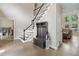 Welcoming foyer with hardwood floors, staircase, coat rack, and sunlit living area at 4365 Dover Crossing Dr, Marietta, GA 30066