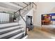 Elegant foyer with hardwood floors, staircase, and coat rack, leading to the dining room at 4365 Dover Crossing Dr, Marietta, GA 30066