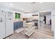 Modern kitchen with white and blue cabinets, butcher block countertop, and stainless steel appliances at 4365 Dover Crossing Dr, Marietta, GA 30066