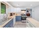 Updated kitchen with butcher block counters, two-tone cabinets, and stainless steel appliances at 4365 Dover Crossing Dr, Marietta, GA 30066