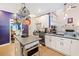 Modern kitchen with white cabinetry, stainless steel appliances, and hardwood floors at 4365 Dover Crossing Dr, Marietta, GA 30066
