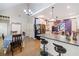 Open-concept kitchen with a breakfast bar, stainless steel appliances, and hardwood flooring at 4365 Dover Crossing Dr, Marietta, GA 30066