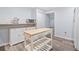 Well-lit kitchen featuring an island, microwave, and stainless steel appliances at 4365 Dover Crossing Dr, Marietta, GA 30066