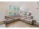 Bright, open-concept living room with hardwood floors connecting to the kitchen at 4365 Dover Crossing Dr, Marietta, GA 30066