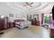 Serene main bedroom with tray ceiling, hardwood floors, and ample natural light at 4365 Dover Crossing Dr, Marietta, GA 30066