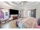 Spacious main bedroom with tray ceiling, hardwood floors, and barn door to the bathroom at 4365 Dover Crossing Dr, Marietta, GA 30066