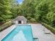 Community pool surrounded by lush greenery, offering a refreshing escape and a relaxing atmosphere at 4365 Dover Crossing Dr, Marietta, GA 30066