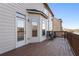 This is a large wooden back deck overlooking a wooded area with chairs and a door to access the house at 6280 Stillwood Ln, Cumming, GA 30041