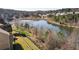 Tranquil backyard view overlooking a serene pond, with mature trees offering privacy at 6280 Stillwood Ln, Cumming, GA 30041