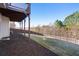 Spacious backyard featuring lush lawn and well-maintained wooden fence, providing a private outdoor space at 6280 Stillwood Ln, Cumming, GA 30041