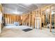 Unfinished basement showing wood frames, concrete floor, and stairway at 6280 Stillwood Ln, Cumming, GA 30041