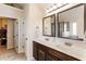 Bathroom featuring a dual vanity with granite countertop with views of shower at 6280 Stillwood Ln, Cumming, GA 30041