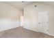 An empty bedroom with carpeted floors and featuring two doors at 6280 Stillwood Ln, Cumming, GA 30041
