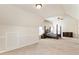 Spacious carpeted bedroom with vaulted ceilings featuring a four-poster bed and dark wood dresser at 6280 Stillwood Ln, Cumming, GA 30041