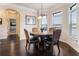 Charming breakfast nook with hardwood floors, crown molding, and natural light at 6280 Stillwood Ln, Cumming, GA 30041