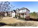 Inviting two-story home with an attached two-car garage and a nicely landscaped front yard at 6280 Stillwood Ln, Cumming, GA 30041
