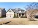 Lovely two-story home featuring a well-kept lawn and a welcoming front porch in a suburban neighborhood at 6280 Stillwood Ln, Cumming, GA 30041