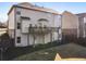 An exterior view showcasing the home's deck, back yard and walk out basement at 6280 Stillwood Ln, Cumming, GA 30041