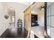 Inviting foyer with dark hardwood floors and a decorative sliding barn door feature at 6280 Stillwood Ln, Cumming, GA 30041