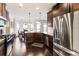 A spacious kitchen with granite countertops, stainless steel appliances, hardwood floors, and access to a bright breakfast nook at 6280 Stillwood Ln, Cumming, GA 30041
