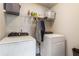 Laundry room equipped with a modern washer and dryer at 6280 Stillwood Ln, Cumming, GA 30041