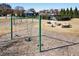 Community playground featuring swings and stone fire pit sitting area great for outdoor fun and relaxation at 6280 Stillwood Ln, Cumming, GA 30041