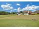Large backyard with a mix of green lawn and open space, backing to a field at 1332 Kent Mnr, Stockbridge, GA 30281