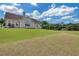 Spacious backyard featuring a lush lawn, with ample space for recreation and outdoor enjoyment at 1332 Kent Mnr, Stockbridge, GA 30281