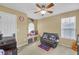 Bedroom features fan, window seat, and sports decor at 1332 Kent Mnr, Stockbridge, GA 30281