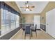 Breakfast nook with vaulted ceiling, bright windows, black table and chairs at 1332 Kent Mnr, Stockbridge, GA 30281
