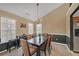 An elegant dining room features a large table and a stylish chandelier at 1332 Kent Mnr, Stockbridge, GA 30281