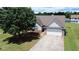 Charming one-story home featuring a well-manicured lawn and a two-car garage at 1332 Kent Mnr, Stockbridge, GA 30281
