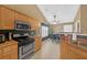Kitchen featuring stainless steel appliances and an adjacent dining area at 1332 Kent Mnr, Stockbridge, GA 30281
