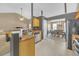 Bright kitchen featuring tile floor, stainless steel appliances, and breakfast bar overlooking dining area at 1332 Kent Mnr, Stockbridge, GA 30281