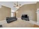 A neutral living room showcases high ceilings, a ceiling fan, and comfortable seating at 1332 Kent Mnr, Stockbridge, GA 30281