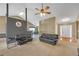 View of spacious living room flows to entrance, featuring modern ceiling fans and design at 1332 Kent Mnr, Stockbridge, GA 30281