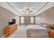 Main bedroom features ceiling fan and a TV on dresser at 1332 Kent Mnr, Stockbridge, GA 30281