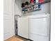 Laundry area featuring a modern washer and dryer set, along with shelving for storage at 860 Peachtree Ne St # 904, Atlanta, GA 30308