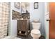 This bathroom features a tiled shower and floors, and an excellent decorative style at 1239 Sharonton Dr, Stone Mountain, GA 30083