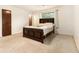 This bedroom features a window, a bed with a decorative headboard, and carpeted floors at 1239 Sharonton Dr, Stone Mountain, GA 30083