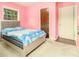 This bedroom features a large bed, two windows, and a closet at 1239 Sharonton Dr, Stone Mountain, GA 30083