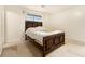 This bedroom features a window, a bed with a decorative headboard, and carpeted floors at 1239 Sharonton Dr, Stone Mountain, GA 30083