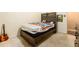 This bedroom features a wooden headboard, artwork, and carpeted floors at 1239 Sharonton Dr, Stone Mountain, GA 30083