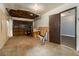 Spacious garage with a connected room and an open ceiling with exposed beams at 1239 Sharonton Dr, Stone Mountain, GA 30083
