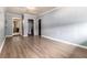 Inviting living room with wood-look floors, light blue wood paneled walls, and ample closet space at 1239 Sharonton Dr, Stone Mountain, GA 30083